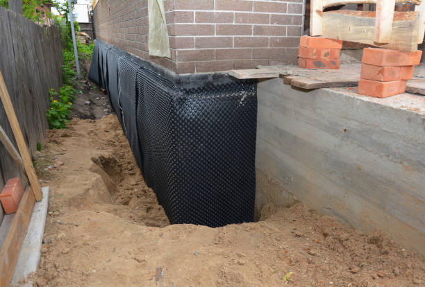 Happy homeowners after waterproofing job in Manawa